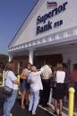 FILE--A crowd of people stand in line outside the Superior Bank branch in Downers Grove, Ill.,  in this July 30, 2001 file photo.  Superior Bank, a $1.8-billion institution that lost millions on home loans to high-risk borrowers was seized by regulators in July. Ellen Seidman, the outgoing director of the federal Office of Thrift Supervision, is being called before Congress to account for her agancy's role in the failure of Superior Bank. (AP Photo/Frank Polich)