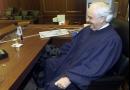 Judge Richard Casey gives his seeing eye dog Coach a little love as he tucks himself under the Judge's courtroom desk Wednesday, Aug. 15, 2001, at the U.S. District Courthouse in New York. Coach accompanies Judge Casey, who is blind, everywhere in the courthouse, sitting quietly under his desk while court is in session. (AP Photo/Beth A. Keiser)