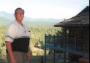 FILE--Bobby Whitefield stands outside his home near Libby, Mont., Tuesday, Aug. 21, 2001. Whitefield, a retired environmental biologist from Texas, moved to Libby despite reports of death and illness linked to asbestos contamination in the area. (AP Photo/Roger Morris)