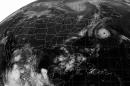 The NOAA satellite picture taken at 5 a.m. EDT Tuesday, Sept. 11, 2001, shows a band of clouds across the Atlantic coast and southern Texas. Clear in the mid-section of the country with clouds streaking across the northern Plains. Hurricane Erin is swirling in the western Atlantic.. (AP Photo/NOAA)