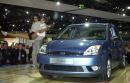 Dancers perform next to the new Ford Fiesta at the Frankfurt, Germany, International Auto Show (IAA), on Tuesday, Sept. 11, 2001, the first day of the Motor Show. (AP Photo/Bernd Kammerer)