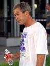 President Bush walks past reporters following a pre-dawn workout at the Longboat Key Club in Sarasota, Fla., Tuesday, Sept. 11, 2001. Bush will visit the at Emma E. Booker Elementary School later Tuesday morning.(AP Photo/Doug Mills)