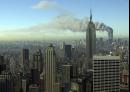 Plumes of smoke pour from the World Trade Center buildings in New York Tuesday, Sept. 11, 2001. Planes crashed into the upper floors of both World Trade Center towers minutes apart Tuesday in a horrific scene of explosions and fires that left gaping holes in the 110-story buildings. (AP Photo/Patrick Sison)