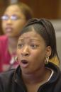 Eleventh-grader Shaya Williams, 16, reacts to the news of the World Trade Center collapsing on CNN television reports at Flint Central High School Tuesday, Sept. 11, 2001, in Flint, Mich. (AP Photo/The Flint Journal, Lisa DeJong)