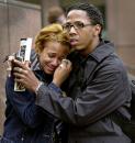 A woman who claimed to have lost an aunt in the terrorist attack on the World Trade Center in New York, is comforted outside a downtown Los Angeles highrise after it was evacuated Tuesday morning, Sept. 11, 2001. Both individuals refused to be identified. Four jetliners, including the two hijacked American Airlines planes that were flown into the World Trade Center towers, causing their collapse Tuesday, were bound for California. (AP Photo/Kevork Djansezian)