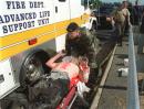 An injured person from the Pentagon is loaded into an ambulance outside the building Tuesday, Sept. 11, 2001, in Washington, after the building took a direct hit from an aircraft. (AP Photo/Will Morris)