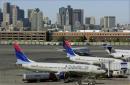 Planes sit idle at gates at Logan International Airport in Boston Tuesday, Sept. 11, 2001, as airports across the United States are shut down in the wake of the crashes into New York's World Trade Center. One of the planes that crashed into the World Trade Center in New York originated in Boston. (AP Photo/Elise Amendola)