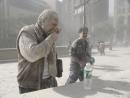 A man coated with ash and debris from the collapse of the World Trade Center south tower coughs near City Hall in lower Manhattan Sept. 11, 2001. (AP Photo/Amy Sancetta)