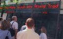 People outside the NBC Studios in New York view reports of the planes that crashed into the twin towers of the World Trade Center, Tuesday, Sept. 11, 2001. Planes crashed into the upper floors of both World Trade Center towers minutes apart Tuesday morning. (AP Photo/Marty Lederhandler)