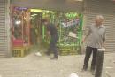 Harry Shasho sweeps up before being evacuated from his vitamin store after the collapse of World Trade Center Tower  Tuesday, Sept. 11, 2001 in New York. (AP Photo/Suzanne Plunkett)