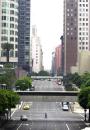 A lone pedestrian walks across a deserted downtown Los Angeles street Tuesday morning, Sept. 11, 2001, following a series of terror attacks on New York and Washington. Public buildings throughout Southern California were evacuated in the aftermath of the terrorist attacks. (AP Photo/Kevork Djansezian)