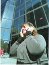 RETRANSMITTING TO ADD IDENTIFICATION - Tracy Yoffe of Uxbridge, Mass., wipes away tears as she makes a call on a cellphone Tuesday, Sept. 11, 2001, in Boston, after she evacuated her law office in the John Hancock Builiding in Boston. Highrise office buildings in downtown Boston were evacauted as a safety precaution following the crashes of two aircraft into the World Trade Center buildings in New York. (AP Photo/Angela Rowlings)