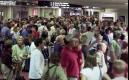 Passengers fill the baggage area at the Charlotte/Douglas International airport in Charlotte, N.C., Tuesday, Sept. 11, 2001. All flights were cancelled after two planes crashed into both World Trade Center towers minutes apart Tuesday in what the President Bush said was an apparent terrorist attack. (AP Photo/Chuck Burton)