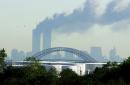 The World Trade Center burning is seen from Carteret, N.J., Tuesday, Sept., 11, 2001. This photo was taken at 9:30 a.m. (AP Photo /Brian Branch-Price)