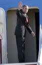 President Bush waves as he boards Air Force One Tuesday morning, Sept. 11, 2001 at Sarasota/Bradenton International Airport in Sarasota, Fla. President Bush cut short his trip to Florida after two planes crashed into the World Trade Center in New York. (AP Photo/Steve Nesius)