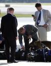 Secret Service agents inspect luggage from members of the media travel pool on the tarmac next to Air Force One, Tuesday morning, Sept. 11, 2001, at Sarasota/Bradenton International Airport in Sarasota, Fla. (AP Photo/Steve Nesius)