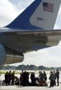 Secret Service agents inspect luggage from members of the media travel pool on the tarmac next to Air Force One Tuesday morning, Sept. 11, 2001, at Sarasota/Bradenton International Airport in Sarasota, Fla. (AP Photo/Steve Nesius)