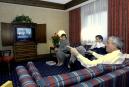 Kentucky Gov. Paul Patton talks with staff members while watching television coverage of the reported terrorist attacks on New York and Washington in his Lexington, Ky., hotel room Tuesday, Sept. 11, 2001.  With Patton are Deputy Chief of Staff Todd Bledsoe and Mary Lassiter, deputy budget director.  What was to have been the final day of activity at the Southern Governors Association meeting in Lexington was cancelled.  (AP Photo/Ed Reinke)