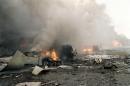 Fires and damage are shown outside the Pentagon Tuesday, Sept. 11, 2001, in Washington, after the building took a direct, devasting hit from an aircraft. (AP Photo/Will Morris)