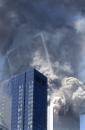 FIRST IN A SERIES OF FOUR PHOTOS--The south tower of the World Trade Center begins to collapse following a terrorist attack on the New York landmark Tuesday, Sept. 11, 2001. (AP Photo/Amy Sancetta)