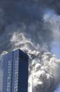 THIRD IN A SERIES OF FOUR PHOTOS--The south tower of the World Trade Center begins to collapse following a terrorist attack on the New York landmark Tuesday, Sept. 11, 2001. Both towers of the WTC eventually fell to the ground after two aircraft crashed into the buildings. (AP Photo/Amy Sancetta)