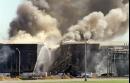 Firefighters battle a blaze at the Pentagon Tuesday, Sept. 11, 2001, after the building took a direct, devasting hit from an aircraft. (AP Photo/Heesoon Yim)