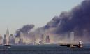 Smoke billows from lower Manhattan, Tuesday, Sept. 11, 2001, in New York, after two planes crashed into the World Trade Center, collapsing the twin 110-story towers. Explosions also rocked the Pentagon and the State Department. (AP Photo/Chad Rachman)