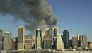 This is a view of the Manhattan skyline as seen from Brooklyn during the collapse of the World Trade Center towers, Tuesday, Sept. 11, 2001, in New York. (AP Photo/Kathy Willens)