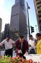 With the Sears Tower behind them, employees of the Chicago's Mercantile Exchange sort trading cards after leaving their building Tuesday morning, Sept. 11, 2001, in Chicago. The Sears Tower was shut down and many workers left the Mercantile building as security measures in response to the attack at the World Trade Center in New York. (AP Photo/M. Spencer Green)