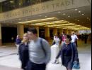 Workers stream from the Chicago Board of Trade on Tuesday, Sept. 11, 2001, after the building was forced to evacuate following the massive attack on the World Trade Center in New York and the Pentagon in Washington. All Chicago exchanges, the Sears Tower and the John Hancock Building were evacuated. (AP Photo/Charles Bennett)