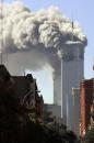 Smoke billows from the upper floors of the World Trade Center in New York after two planes crashed into the buildings Tuesday morning, Sept. 11, 2001.  (AP Photo/Lisa Mauceri and Miech Godderie, Digital Photo Imaging)