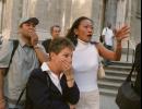 People in front of New York's St. Patrick's Cathedral react with horror as they look down Fifth Ave towards the World Trade Center towers after planes crashed into their upper floors Tuesday morning, Sept. 11, 2001. Explosions and fires left gaping holes in the 110-story buildings and President Bush said the crashes were apparently the work of terrorists.  (AP Photo/Marty Lederhandler)