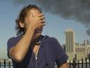 A woman reacts to the apparent terrorist attack of the World Trade towers, while observing from the Brooklyn Promendade, which provides a view of the Manhattan skyline Tuesday, Sept. 11, 2001, in New York. (AP Photo/Kathy Willens)