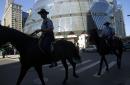 Mounted Chicago police ride past the Thompson Center in downtown Chicago Tuesday, Sept. 11, 2001. Many of Chicago's downtown buildings have been evacuated as a security measure in reaction to the attack on the World Trade Center in New York. (AP Photo/M. Spencer Green)