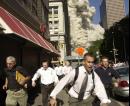 People run from the collapse of World Trade Center Tower  Tuesday, Sept. 11, 2001 in New York. (AP Photo/Suzanne Plunkett)