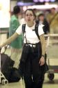 An unidentified passenger cries as she stands inside Miami International Airport in Miami, Tuesday, Sept. 11, 2001. Two passenger planes crashed into the World Trade Center in New York towers earlier in the day. All U.S. airports were closed leaving thousands stranded. (AP Photo/Marta Lavandier)