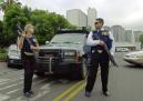 A pair of unidentified FBI agents stand guard at an entrance to the Federal Building, center-rear, in the Westwood district of Los Angeles, Tuesday, Sept. 11, 2001. Authorities went on alert from coast to coast Tuesday, halting all air traffic, evacuating high-profile buildings and tightening security at strategic facilities following the attacks on the World Trade Center and the Pentagon. (AP Photo/Reed Saxon)