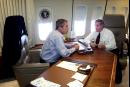 President Bush talks with Chief of Staff Andrew Card aboard Air Force One during a flight to Offutt Air Force Base in Omaha, Neb., following the presidents' statement about the terrorist attack on the World Trade Center in New York City, Tuesday, Sept. 11, 2001. (AP Photo/Doug Mills)