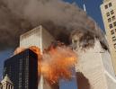 RETRANSMITTED TO PROVIDE ALTERNATE CROP -- Smoke billows from one of the towers of the World Trade Center and flames and debris explode from the second tower, Tuesday, Sept. 11, 2001. In one of the most horrifying attacks ever against the United States, terrorists crashed two airliners into the World Trade Center in a deadly series of blows that brought down the twin 110-story towers. (AP Photo/Chao Soi Cheong)