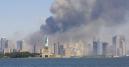 The Statue of Liberty stands as smoke billows from the World Trade Center in New York, Tuesday, Sept 11, 2001. Mounting an audacious attack against the United States, terrorists crashed two hijacked airliners into the World Trade Center and brought down the twin 110-story towers. (AP Photo/Stuart Ramson)