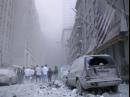 Dust and debris cloud the air near the site of the terrorist attack on the World Trade Center in New York, Tuesday, Sept. 11, 2001. (AP Photo/Bernadette Tuazon)