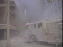 A fire truck is surrounded by dust and debris near the site of the terrorist attack on the World Trade Center in New York, Tuesday, Sept. 11, 2001. (AP Photo/Bernadette Tuazon)