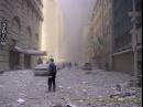 Dust and debris cover the ground and cloud the air near the site of the terrorist attack on the World Trade Center in New York, Tuesday, Sept. 11, 2001. (AP Photo/Bernadette Tuazon)