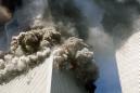 The south tower of the World Trade Center, left, begins to collapse after a terrorist attack on the landmark buildings in New York, Tuesday, Sept. 11, 2001. (AP Photo/Gulnara Samiolava)