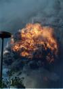 The south tower of the World Trade Center erupts in flames as it is struck by a second plane in a terrorist attack on the landmark complex Tuesday, Sept. 11, 2001, in New York.  (AP Photo/Ernesto Mora)