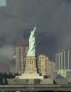 Thick smoke billows into the sky from the area behind the Statue of Liberty where the World Trade Center towers stood Tuesday, Sept. 11, 2001.  The towers collapsed after terrorists crashed two planes into them Tuesday. (AP Photo/Daniel Hulshizer)