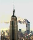 Smokes billows from the World Trade Center towers in New York Tuesday, Sept. 11, 2001, after two aircraft hit the upper floors of the buildings.  The Empire State Building is in the foreground. (AP Phoito/Marty Lederhandler)