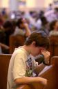 Emily Davies sheds tears while praying before a Mass at the Cathedral of the Incarnation in Nashville, Tenn., for the victims of the attacks against the United States, Tuesday, Sept. 11, 2001. (AP Photo/Christopher Berkey)