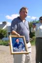 Jim Ogonowski, brother of American Airlines pilot John Ogonowski of Dracut, Mass., holds a photo Tuesday, Sept. 11, 2001 outside his brother's home in Dracut,  who was the pilot of the American Airlines plane that was hijacked and  crashed into the World Trade Center in New York. (AP Photo/ Robert Sheehan)