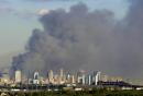 Smoke rises from lower Manhattan following the destruction of buildings at the World Trade Center in New York, Tuesday, Sept. 11, 2001. Mounting an attack against the United States, terrorists crashed two hijacked airliners into the World Trade Center and brought down the twin 110-story towers. (AP Photo/Charles Krupa)